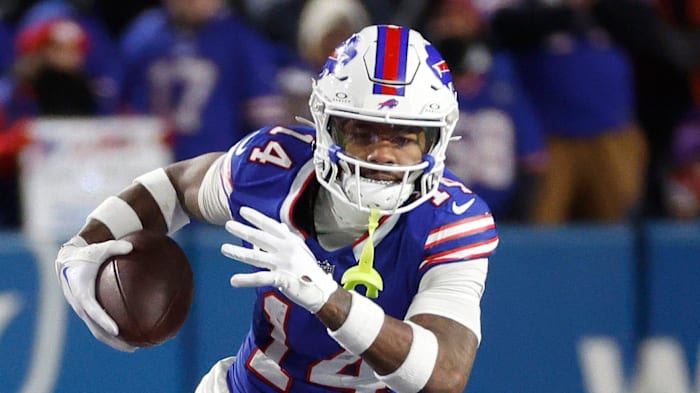 Buffalo Bills wide receiver Stefon Diggs (14) looks for running room after a catch.