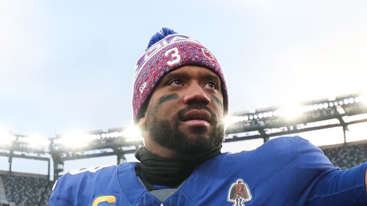 Former Seattle Seahawks quarterback Russell Wilson waves to fans