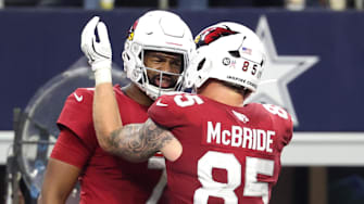 Nov 3, 2025; Arlington, Texas, USA;  Arizona Cardinals tight end Trey McBride (85) celebrates with quarterback Jacoby Brissett (7) after scoring a touchdown against the Dallas Cowboys in the second half at AT&T Stadium. Mandatory Credit: Kevin Jairaj-Imagn Images