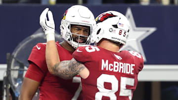 Nov 3, 2025; Arlington, Texas, USA;  Arizona Cardinals tight end Trey McBride (85) celebrates with quarterback Jacoby Brissett (7) after scoring a touchdown against the Dallas Cowboys in the second half at AT&T Stadium. Mandatory Credit: Kevin Jairaj-Imagn Images