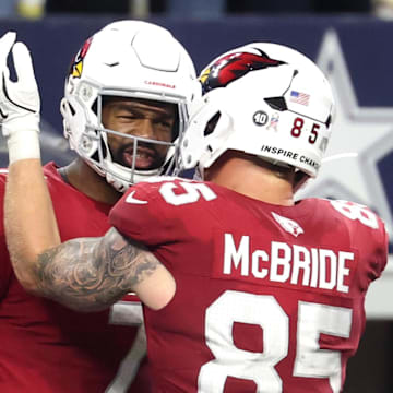 Nov 3, 2025; Arlington, Texas, USA;  Arizona Cardinals tight end Trey McBride (85) celebrates with quarterback Jacoby Brissett (7) after scoring a touchdown against the Dallas Cowboys in the second half at AT&T Stadium. Mandatory Credit: Kevin Jairaj-Imagn Images