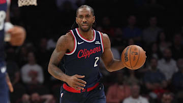 Clippers forward Kawhi Leonard brings the ball up the court against the Heat. The Clippers lost and dropped to 5–16.