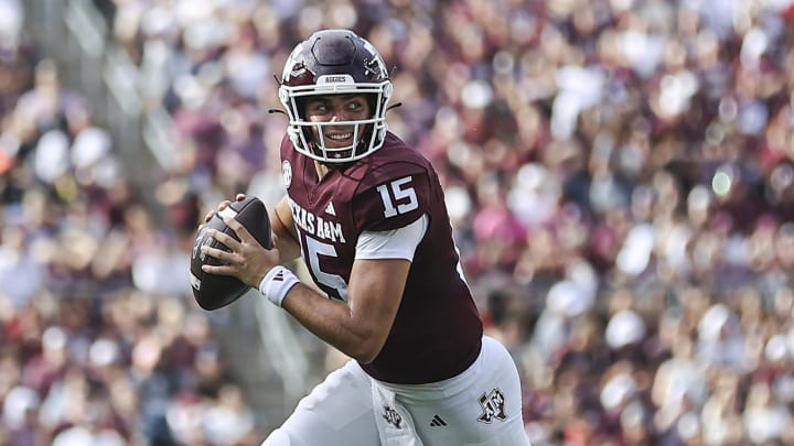 Sep 16, 2023; College Station, Texas, USA; Texas A&M Aggies quarterback Conner Weigman (15) rolls out of the pocket on a play during the second quarter against the Louisiana Monroe Warhawks at Kyle Field. Mandatory Credit: Troy Taormina-USA TODAY Sports