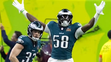 Feb 9, 2025; New Orleans, LA, USA; Philadelphia Eagles cornerback Cooper DeJean (33) celebrates with linebacker Jalyx Hunt (58) after returning an interception for a touchdown against the Kansas City Chiefs in the second quarter in Super Bowl LIX at Ceasars Superdome. Mandatory Credit: Mark J. Rebilas-Imagn Images