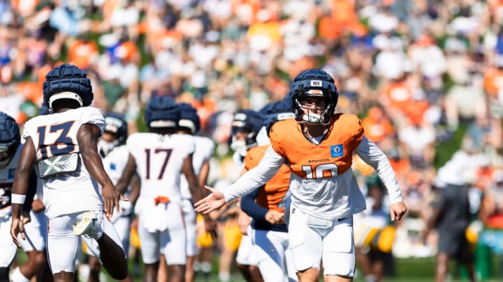 Denver Broncos Bo Nix (10) runs off the field during joint practice sessions with the Green Bay Packers. 