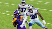 Minnesota Vikings wide receiver Justin Jefferson catches a touchdown against Dallas Cowboys cornerback Anthony Brown