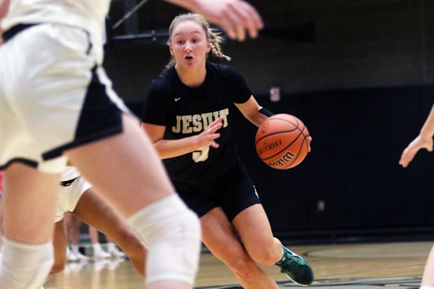 Jesuit senior Audrey Bayless looks for room to drive in the Crusaders’ Metro League contest at Mountainside.