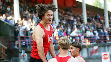 Oregon City’s (from left) Keaton Moore, Easton Hunt and Colin Smith celebrate after the Pioneers’ 4x100-meter state-record run of 41.00 seconds at the Three Rivers League district championships.
