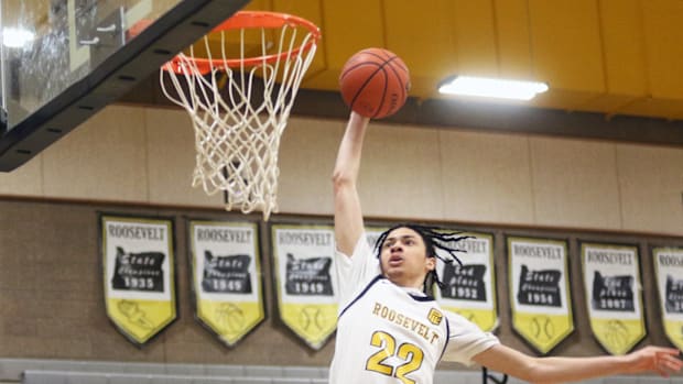 Roosevelt junior Syrius Owens goes for up one of his four second-half dunks in the Roughriders’ 73-53 win over Grant.