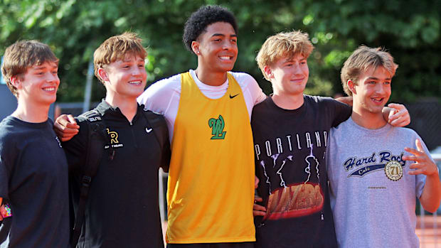 West Linn senior Warren Stanton poses with friends and teammates during competition at the Three Rivers League districts.