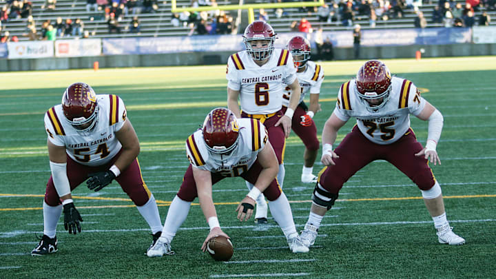 John McGregor (center) helped Central Catholic win the 6A football championship in 2023.