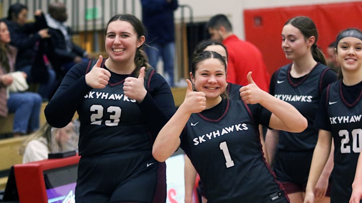 Southridge juniors Addison White (left) and Sara Mangan are all smiles after the Skyhawks’ 60-29 victory at Westview.