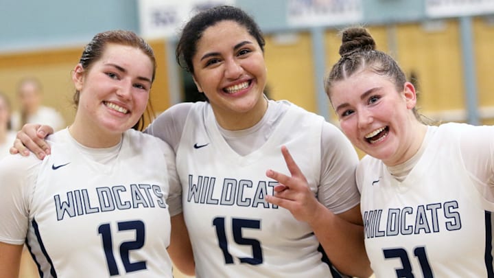 Wilsonville’s (from left) Audrey Counts, Fareeda ElManhawy and Gabi Moultrie are all smiles after the Wildcats’ 53-41 win over Corvallis in Friday’s Class 5A state playoff game.