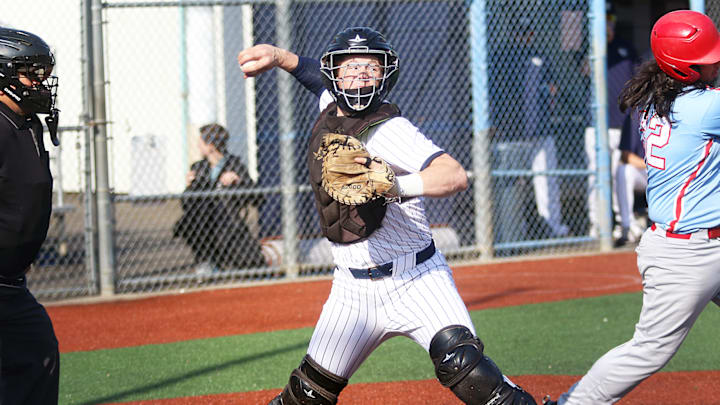Wilsonville senior catcher Mark Wiepert makes a pickoff throw to first base during the Wildcats’ 15-1 win over Centennial. Wilsonville senior catcher Mark Wiepert makes a pickoff throw to first base during the Wildcats’ 15-1 win over Centennial.