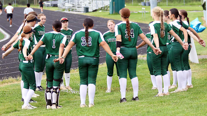 West Salem players gather behind the dugout before their game at Century. The Titans picked up their 11th consecutive victory win a 4-0 win.