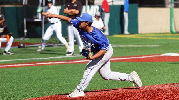 Grant junior pitcher Jinki Tomita fires a pitch to the plate during the Generals’ 8-2 win at Jesuit.