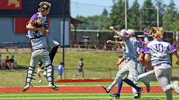 Sunset catcher Kyle Gresham (13) hugs pitcher Kruz Schoolcraft as other Apollos, including Parker Raubuch (10), Luke Sullivan (7) and Marcus Pollard (4) rush in following the final out in Sunset’s 6-5 win over Grant in the Class 6A state championship game.