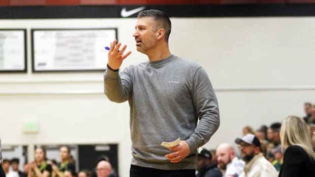 Tualatin coach Wes Pappas calls out instructions in the second half of the Timberwolves’ 55-30 win over West Linn.