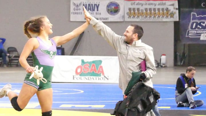 Wells junior Zorina Johnson capped a dominant run through the Class 6A/5A girls 130-pound bracket with a technical fall over fellow returning champion Sadie Hall of North Medford in Saturday's final.