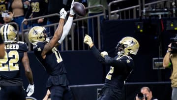 Jan 7, 2024; New Orleans, Louisiana, USA;  New Orleans Saints wide receiver A.T. Perry (17) celebrates a touchdown with wide receiver Chris Olave (12) against the Atlanta Falcons during the first half at Caesars Superdome. Mandatory Credit: Stephen Lew-USA TODAY Sports