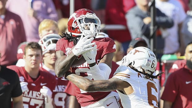 Arkansas wide receiver Andrew Armstrong catches a long pass against Texas Longhorns defensive back Kobe Black 