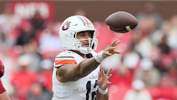 Oct 25, 2025; Fayetteville, Arkansas, USA; Auburn Tigers quarterback Ashton Daniels (12) passes during the fourth quarter against the Arkansas Razorbacks at Donald W. Reynolds Razorback Stadium. Mandatory Credit: Nelson Chenault-Imagn Images