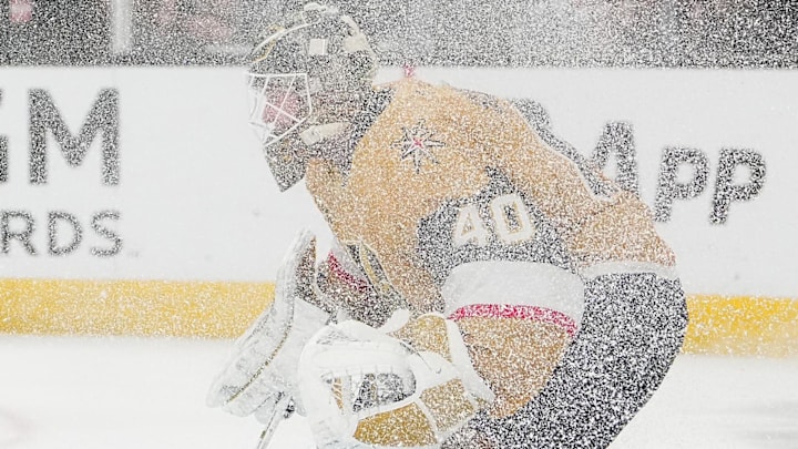 Mar 19, 2026; Las Vegas, Nevada, USA; Vegas Golden Knights goaltender Akira Schmid (40) is engulfed in ice shavings as he defends his net against the Utah Mammoth during the third period at T-Mobile Arena. Mandatory Credit: Stephen R. Sylvanie-Imagn Images