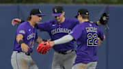 Colorado Rockies outfielders celebrate after beating the Miami Marlins at loanDepot Park. 