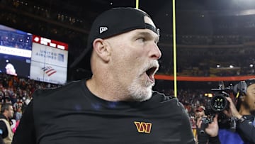 Oct 27, 2024; Landover, Maryland, USA;Washington Commanders head coach Dan Quinn celebrates while leaving the field after the Commanders' game against the Chicago Bears  at Northwest Stadium. Mandatory Credit: Geoff Burke-Imagn Images