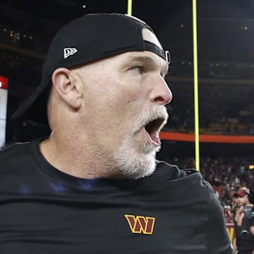 Oct 27, 2024; Landover, Maryland, USA;Washington Commanders head coach Dan Quinn celebrates while leaving the field after the Commanders' game against the Chicago Bears  at Northwest Stadium. Mandatory Credit: Geoff Burke-Imagn Images