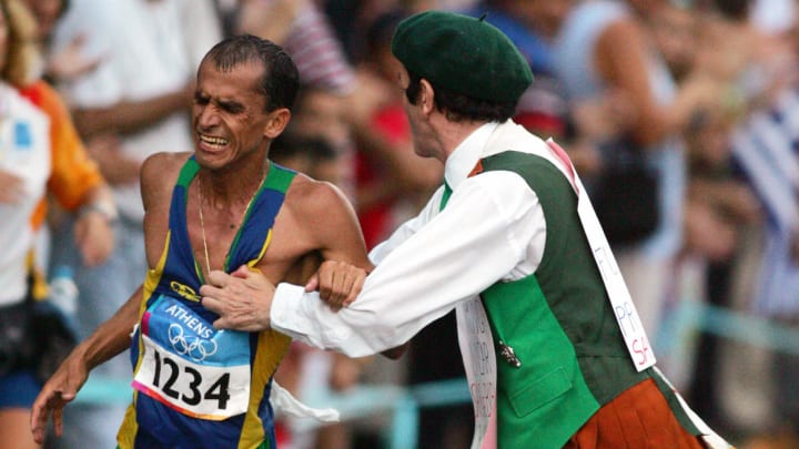 Vanderlei Lima getting attacked by Neil Horan at the 2004 Summer Olympics.