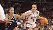 Wisconsin's Lily Krahn drives to the basket against Northwestern's Caroline Lau during the first half at the Kohl Center in Madison, Wisconsin on Sunday Feb. 23, 2025.