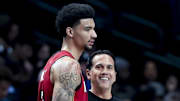Feb 13, 2025; Dallas, Texas, USA;  Miami Heat head coach Erik Spoelstra laughs with Miami Heat center Kel'el Ware (7)during the first half against the Dallas Mavericks at American Airlines Center. Mandatory Credit: Kevin Jairaj-Imagn Images