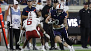 Sep 20, 2025; Charlottesville, Virginia, USA; Virginia Cavaliers tight end Sage Ennis (0) runs with the ball after making a catch as Stanford Cardinal cornerback Collin Wright (6) defends during the first quarter at Scott Stadium. Mandatory Credit: Geoff Burke-Imagn Images