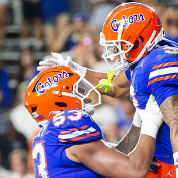 Florida Gators wide receiver Eugene Wilson III (3) celebrates his touchdown with Florida Gators offensive lineman Bryce Lovett (53) during the second half to make it 38-7 after the extra point at Ben Hill Griffin Stadium in Gainesville, FL on Saturday, September 7, 2024 against the Samford Bulldogs. The Florida Gators won 45-7 over the Bulldogs. [Doug Engle/Gainesville Sun]