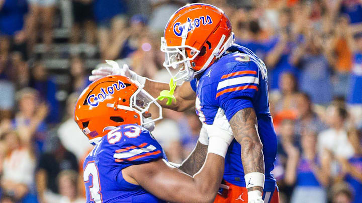 Florida Gators wide receiver Eugene Wilson III (3) celebrates his touchdown with Florida Gators offensive lineman Bryce Lovett (53) during the second half to make it 38-7 after the extra point at Ben Hill Griffin Stadium in Gainesville, FL on Saturday, September 7, 2024 against the Samford Bulldogs. The Florida Gators won 45-7 over the Bulldogs. [Doug Engle/Gainesville Sun]