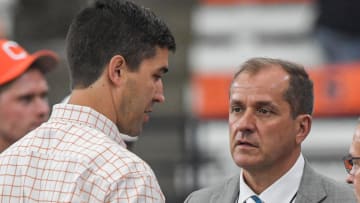 Sep 30, 2023; Syracuse, New York, USA; Clemson Tigers athletic director Graham Neff, left, and ACC Commissioner Jim Phillips talk before the game with the Syracuse Orange at JMA Wireless Dome. Mandatory Credit: Ken Ruinard-USA TODAY Sports