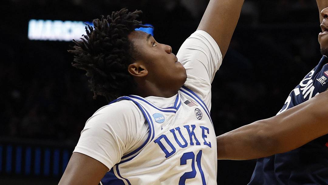 Mar 29, 2026; Washington, DC, USA; UConn Huskies forward Tarris Reed Jr. (5) shoots the ball over Duke Blue Devils center Patrick Ngongba (21) during an Elite Eight game of the East Regional of the men's 2026 NCAA Tournament at Capital One Arena. Mandatory Credit: Geoff Burke-Imagn Images