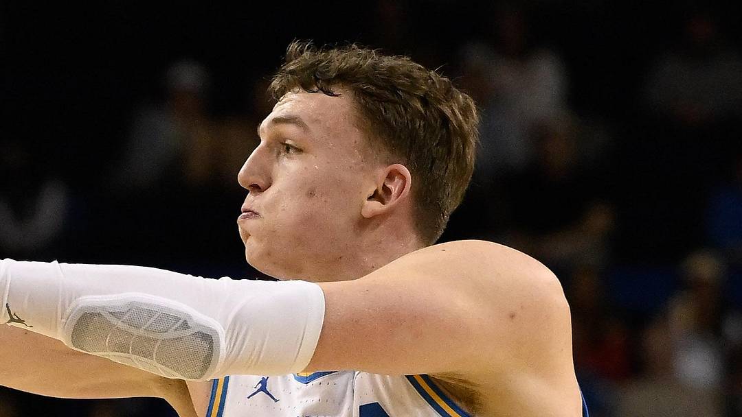Mar 3, 2026; Los Angeles, California, USA; UCLA Bruins forward Tyler Bilodeau (34) passes the ball as Nebraska Cornhuskers forward Braden Frager (5) defends during the 1st half at Pauley Pavilion presented by Wescom Financial. Mandatory Credit: Robert Hanashiro-Imagn Images