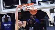 Lutheran East's Jesse McCulloch (35) dunks the ball during his team's win over Harvest Prep in the Division III state championship game Sunday, March 24, 2024.