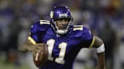 Nov 21, 2004; Minneapolis, MN, USA; Minnesota Vikings quarterback #11 Daunte Culpepper runs to the one-yard line against the Detroit Lions defense in 2nd half action at the Metrodome. The Vikings won 22-19. Mandatory Credit: Photo By Bruce Kluckhohn-Imagn Images Copyright (c) 2004 Bruce Kluckhohn

