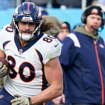 Denver Broncos tight end Greg Dulcich (80) is tackled by Tennessee Titans safety Joshua Kalu (28) during the fourth quarter at Nissan Stadium Sunday, Nov. 13, 2022, in Nashville, Tenn.