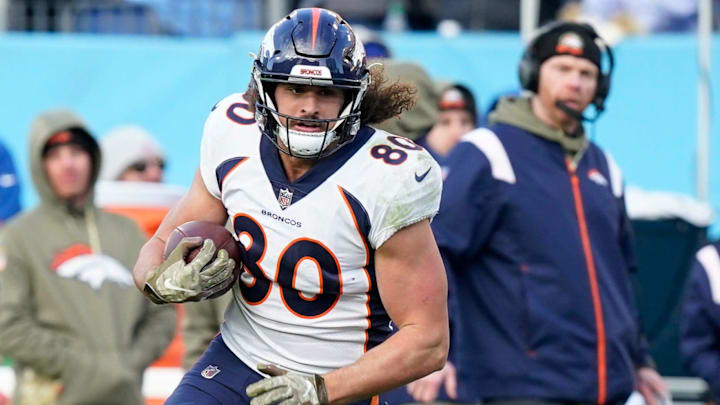 Denver Broncos tight end Greg Dulcich (80) is tackled by Tennessee Titans safety Joshua Kalu (28) during the fourth quarter at Nissan Stadium Sunday, Nov. 13, 2022, in Nashville, Tenn.