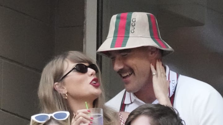 Taylor Swift and Kansas City Chiefs tight end Travis Kelce talk