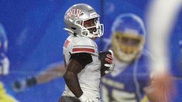 Nov 22, 2024; San Jose, California, USA; UNLV Rebels running back Jai'Den Thomas (9) runs for a touchdown against the San Jose State Spartans during the third quarter at CEFCU Stadium.
