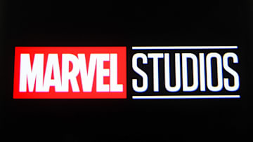 In this photo illustration a Marvel Studios logo is seen on...