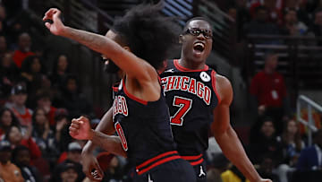 Nov 22, 2024; Chicago, Illinois, USA; Chicago Bulls forward Jalen Smith (7) celebrates with guard Coby White (0) after scoring against the Atlanta Hawks during the second half at United Center. Mandatory Credit: Kamil Krzaczynski-Imagn Images