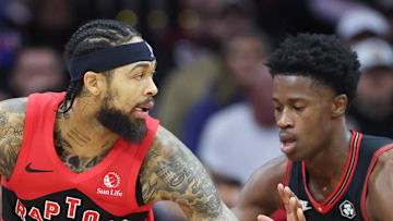 Toronto Raptors forward Brandon Ingram controls the ball against Philadelphia 76ers guard VJ Edgecombe.