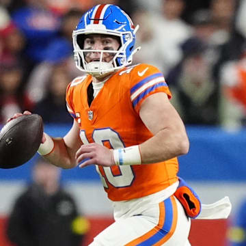 Nov 6, 2025; Denver, Colorado, USA; Denver Broncos quarterback Bo Nix (10) drops back to pass against the Las Vegas Raiders during the first half at Empower Field at Mile High. 