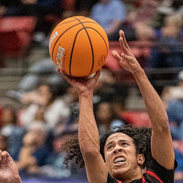 Victory Christian (2) Miles Morrell shoots over North Tampa Christian (4) Caleb Sanders during the FHSAA 1A state semi final game at the RP Funding Center Tuesday February 25, 2025 in Lakeland Fl. Victory won 65-63 in 4 overtime periods.
Ernst Peters/The Ledger